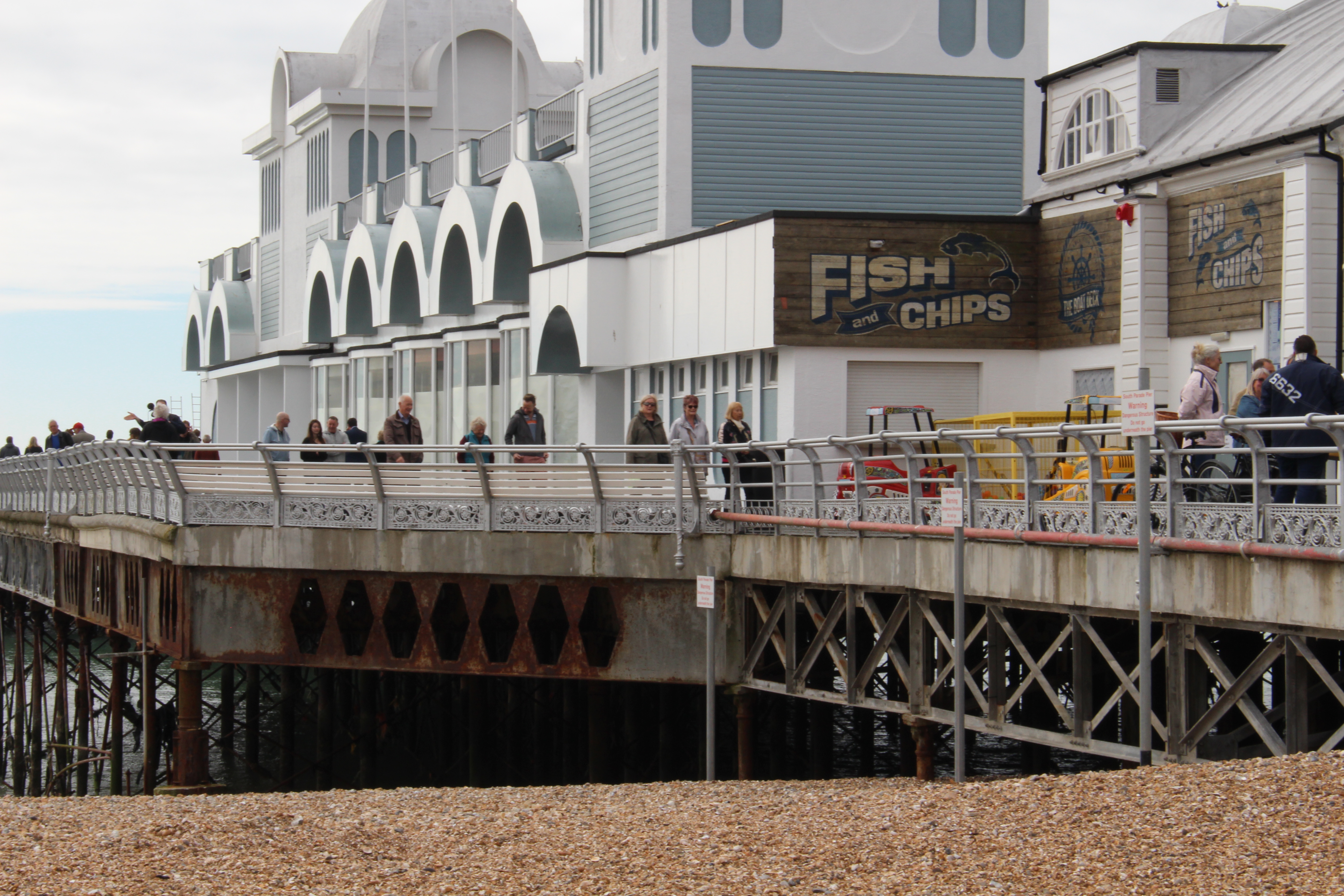 People enjoying South Parade Pier