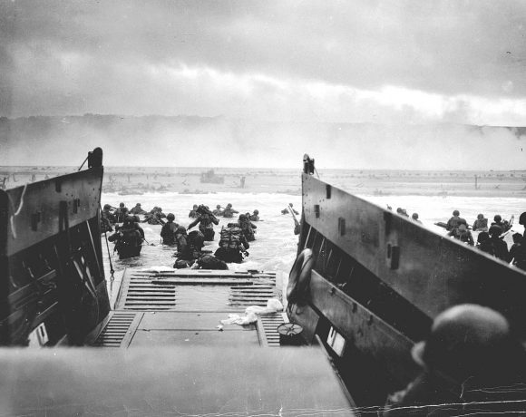 Handout photo of U.S. troops wading ashore from a Coast Guard landing craft at Omaha Beach during the Normandy D-Day landings near Vierville sur Mer