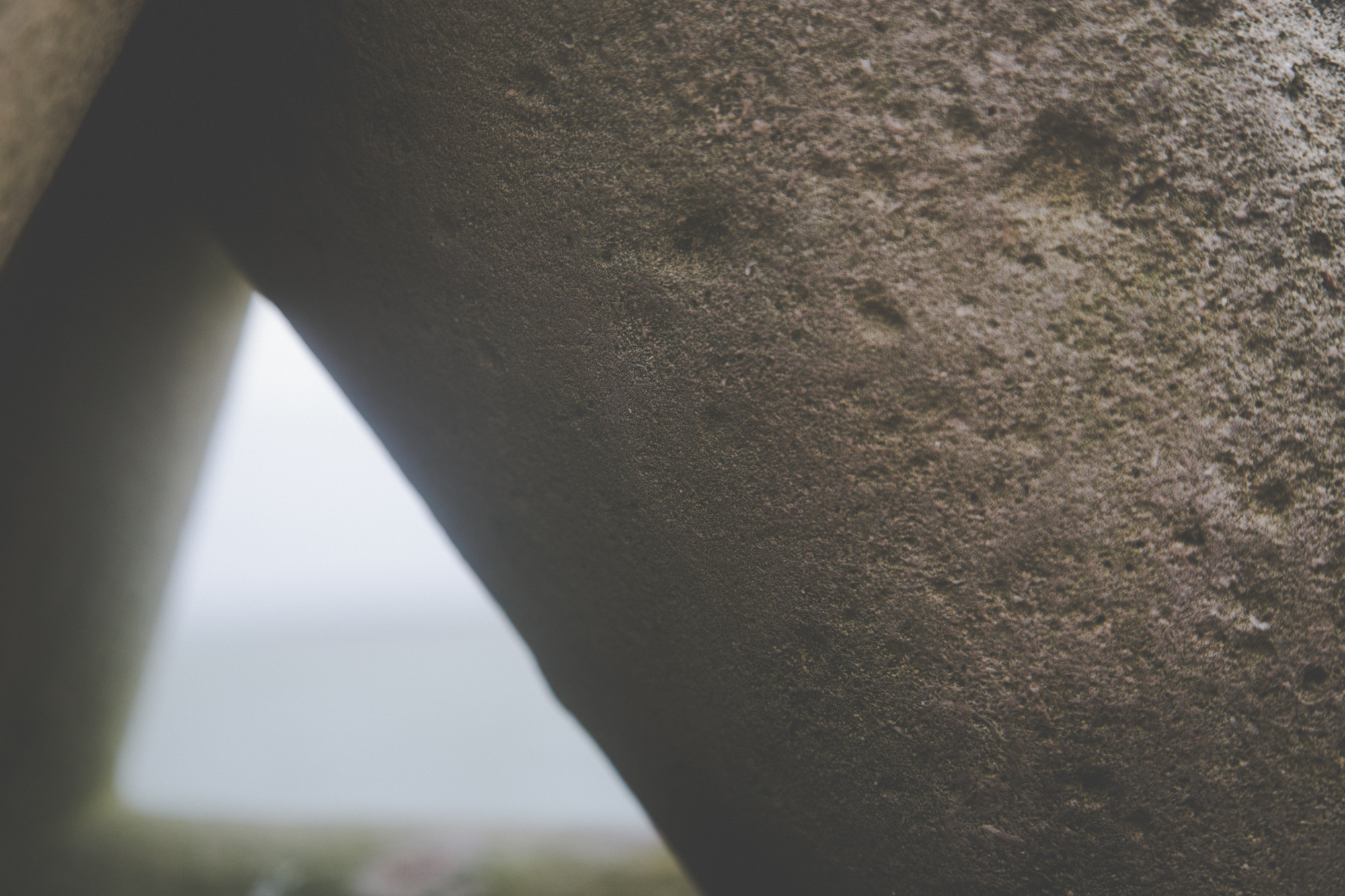 The weathered concrete of a John Maine sculpture