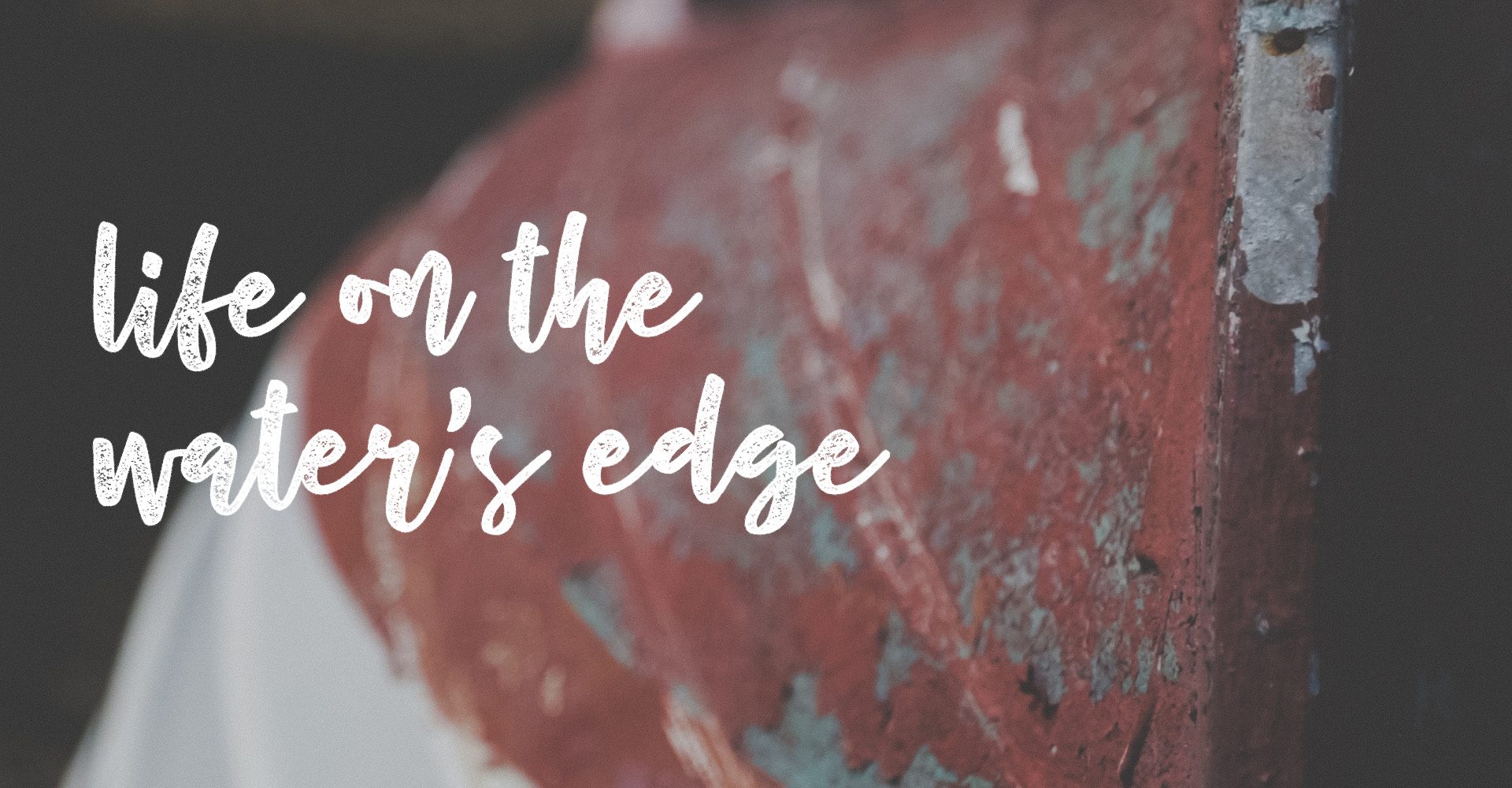 Title for the film Life on the Water's Edge over an old upturned tender