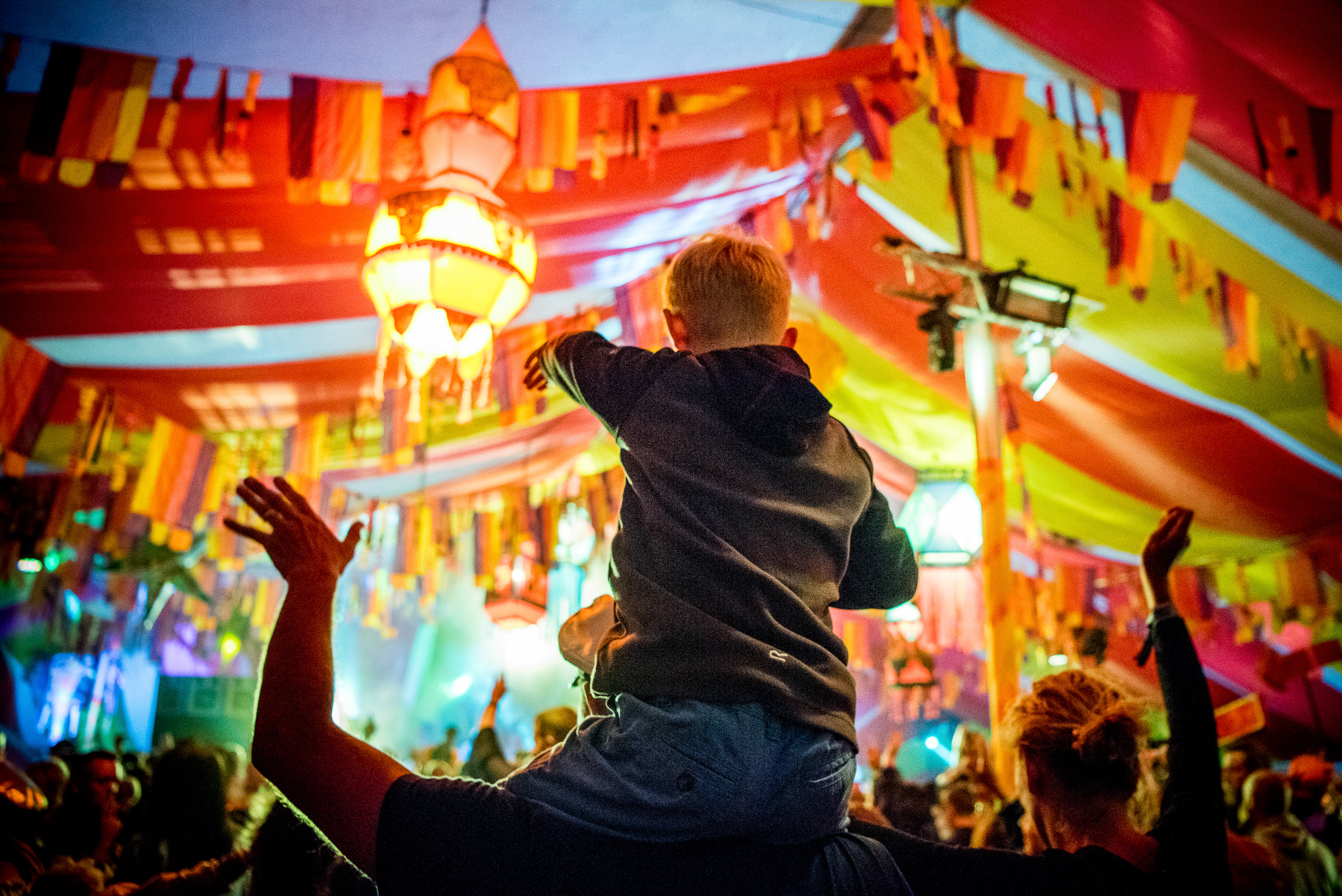 Families enjoying the Basement Jaxx in the Bollywood tent