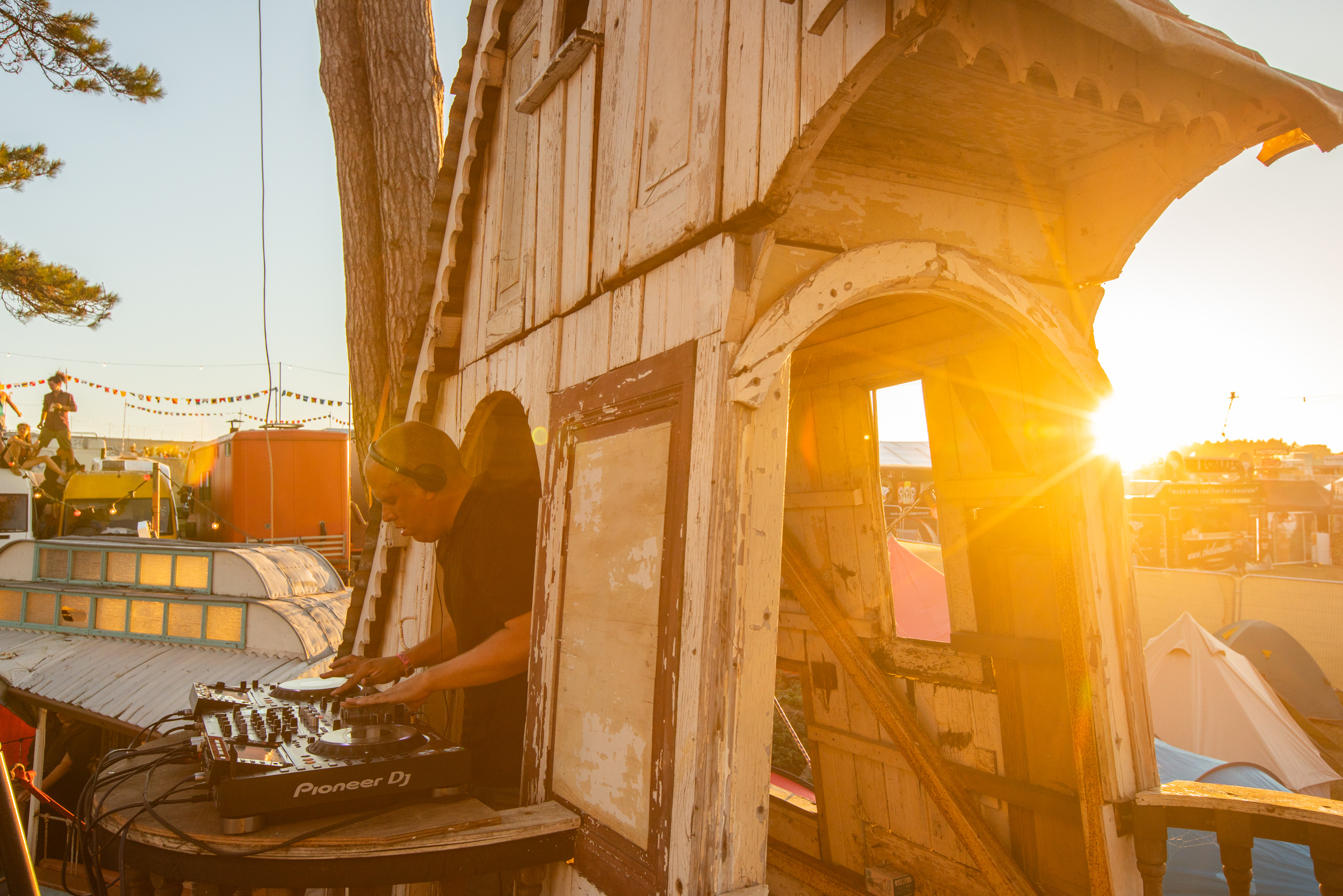 A Dj plays in a the Caravanserai area