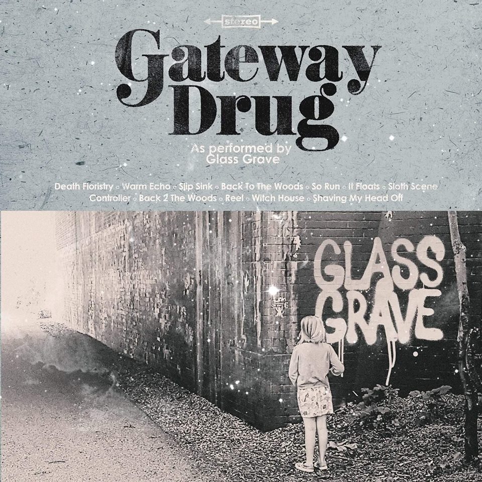 Glass Grave LP Cover. A black and white photo of a child looking at graffiti reading Glass Grave