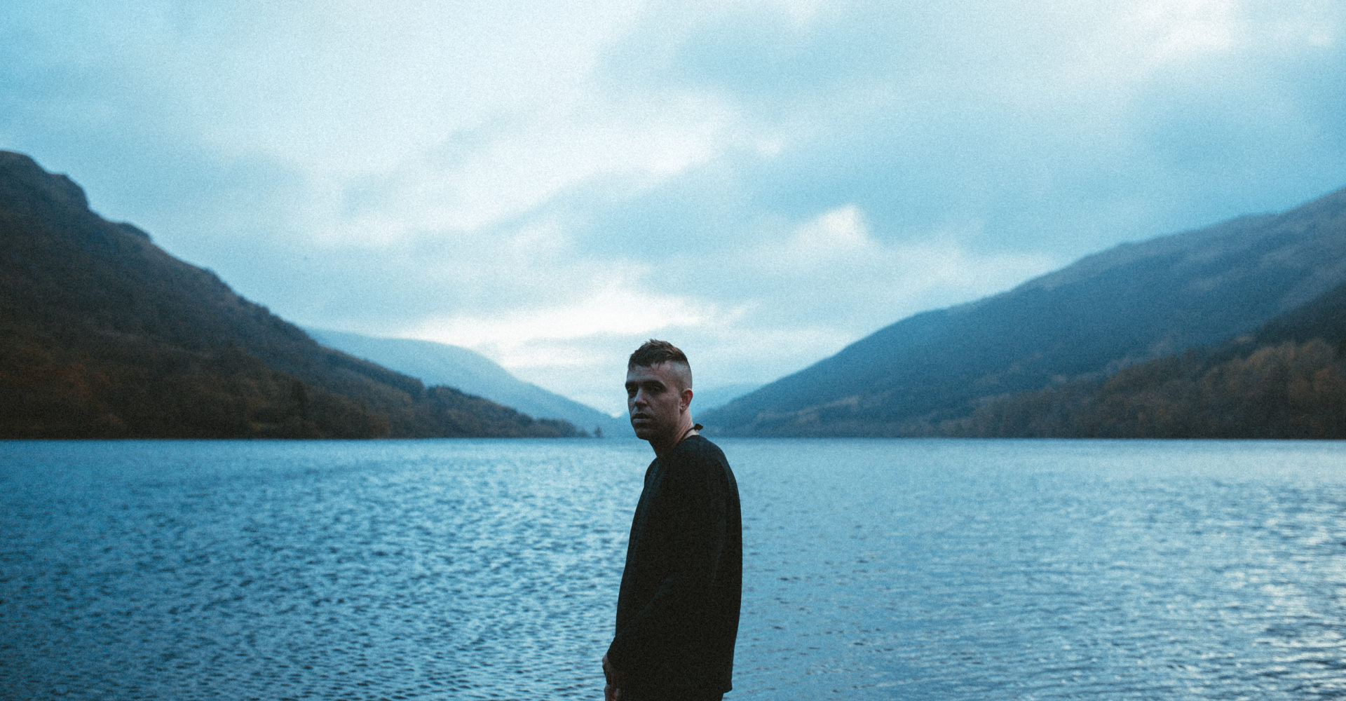 Benjamin Francis Leftwich stood in front of a lake