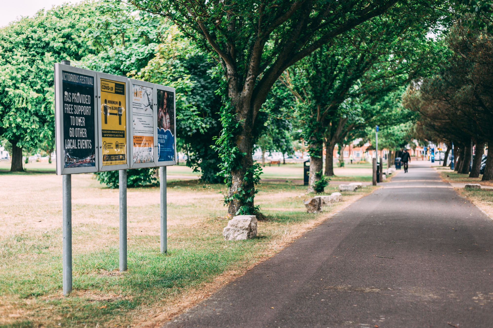 Row of posterboards down a Southsea pathway