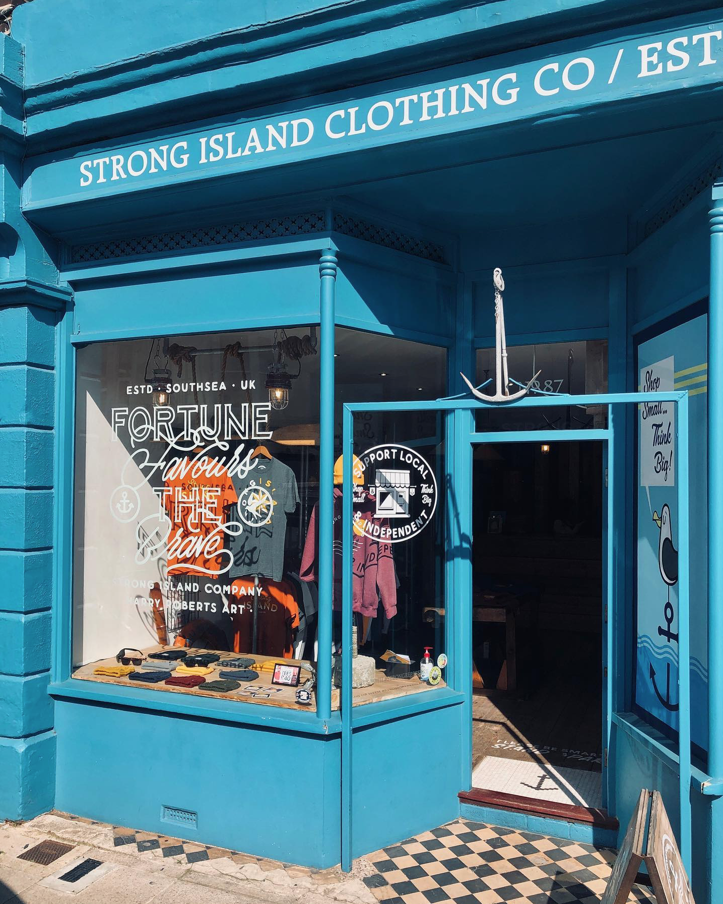 Window artwork to the Strong Island Clothing Co store